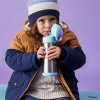 Child drinking from the BBox Frozen Stainless Steel Drink Bottle against a purple background
