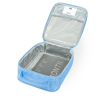 An open Montii Darling Bows Large Insulated Lunch Bag with a aluminum lining, shown on a white background. The inside features the MontiiCo's best-selling ice pack, and a white name tag is visible inside the lid.