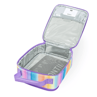 An open Montii Sunset Skies Large Insulated Lunch Bag with a purple handle and trim, featuring an aluminum interior. A name label and the MontiiCo's best-selling ice pack are visible inside.