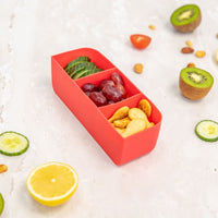 Montii Feast Tray with compartments filled with fruits and nuts on a white surface.