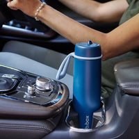 Midnight b.box water bottle in a car cup holder